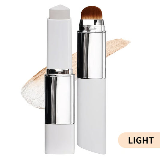 White and silver cover cream stick foundation with attached brush, swatch shown in light shade